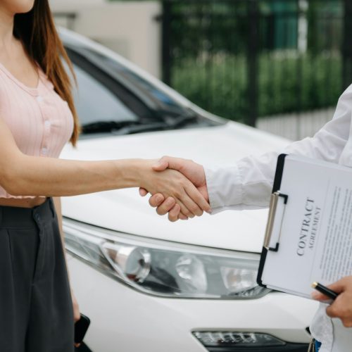 Automotive business, car sale or rental concept Customer with car dealer agent making deal